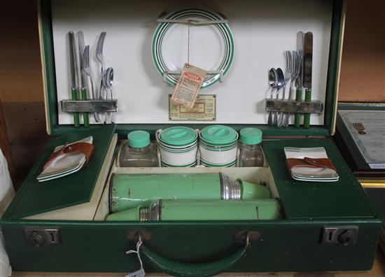 1950s car picnic set in green suitcase with initials HHA and maker label for Sirram Tea & Lunch Outfit